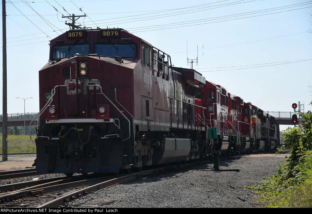 Westbound manifest crosses over to enter the yard